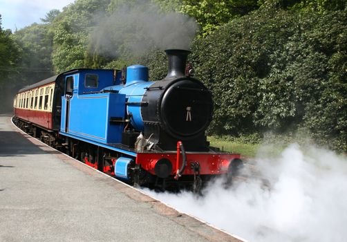 steam locomotive with steam and smoke