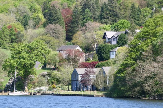 large houses amongst the trees with  beautiful landscape gardens