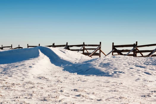 snow background with wave and snowdrift with blue sky