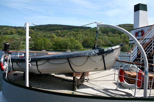 covered lifeboat on a tourist lake cruiser 