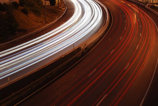 a night time shot of speeding traffic on a freeway