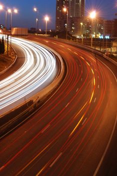 a night time shot of speeding traffic on a freeway