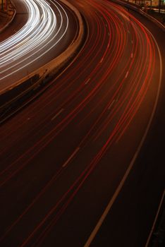 a night time shot of speeding traffic on a freeway