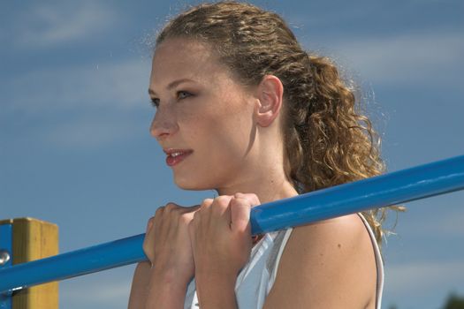 Pretty blond woman doing some exercises outdoors