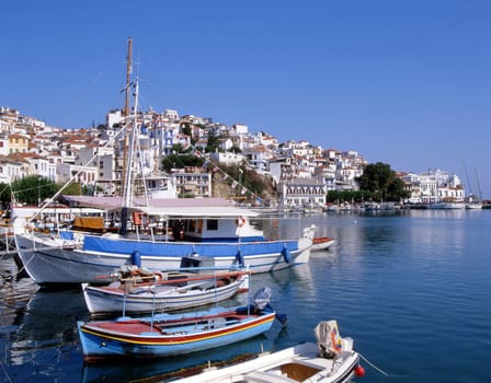 Skopelos town. A greek island. Looking over the harbour towards the church.