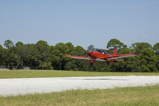 A private plane takes off from a small airport.