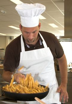 Italian chef throwing the pasta in the air