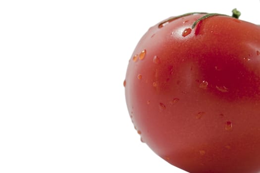 fresh red tomatoes in a heap on a light background