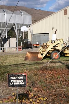 Farm buildings and equipment with a keep out sign