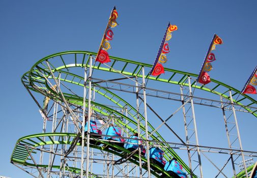 Cars transporting people on a roller coaster