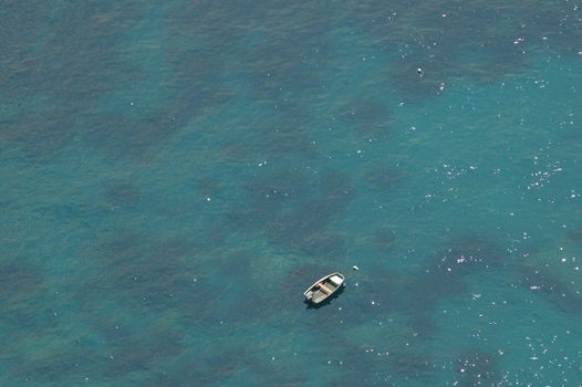 Wood boat in the blue sea