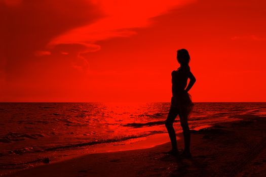 Teenage girl on the beach at sunset. Processed Editor