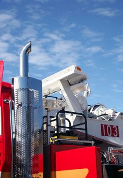 Partial fire engine with beautiful blue cloudy sky