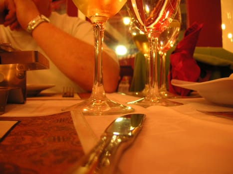 details of the glasses and knife on a restaurant table