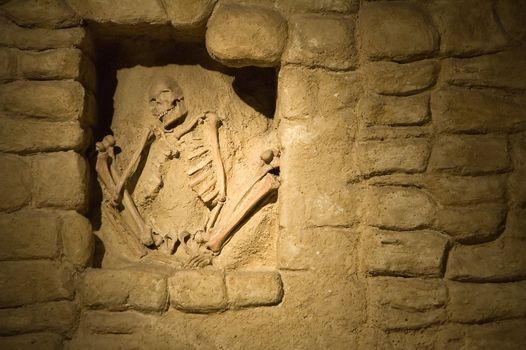 old historical skeleton buried inside a wall