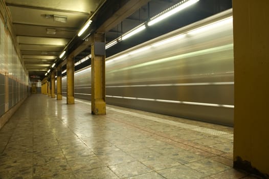 train in motion in subway station, photo taken in new york