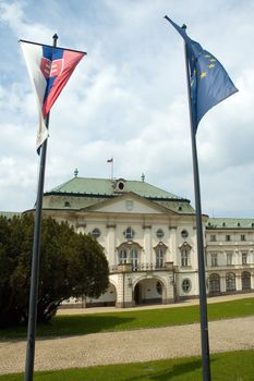 slovak government building, slovak and european union flag in foreground 