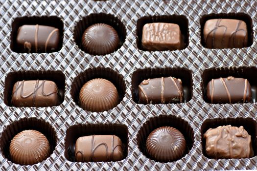 Box of chocolates, dark and milk chocolate, round and squares, all yummy.