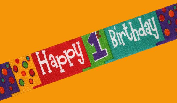 Banner stating happy first birthday isolated on a color background
