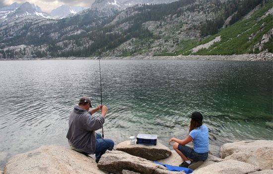 Father and daughter fishing in a High Sierras lake