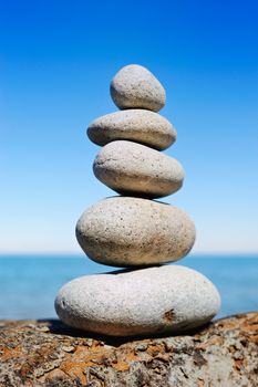 Pile of white pebbles on the edge of cliff