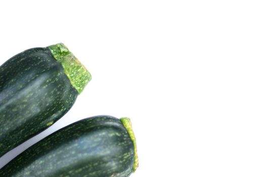 two courgettes isolated over a white background