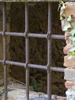 old windows with rusty bar