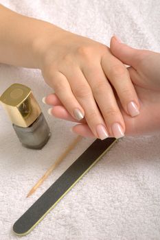 polishing the fingernails and manicure in a beautycenter