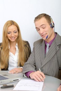 a happy business team at work- two persons