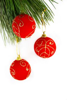 Red balls on Christmas tree isolated on white background