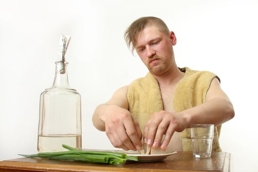 The man drinks moonshine and has a snack fat and an onions