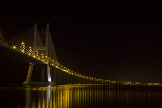 Vasco da Gama bridge on river Tagus, Lisbon at night