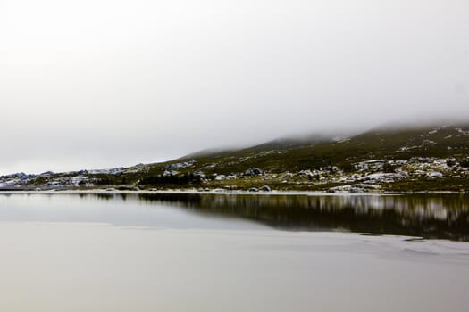 Landscape with lake, rocks and fog in Serra da Estrela � mountain range in Portugal (Mountain Range of the Star)