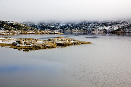 Landscape with lake, rocks and fog in Serra da Estrela � mountain range in Portugal (Mountain Range of the Star)