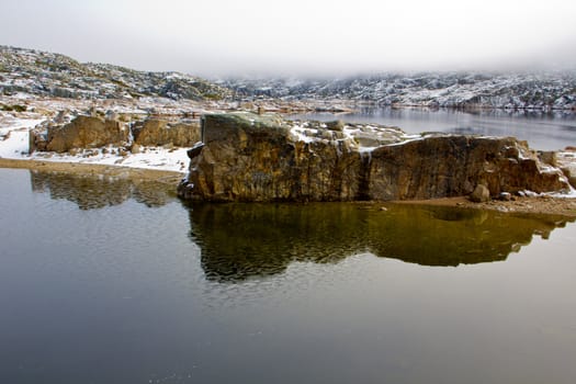 Landscape with lake, rocks and fog in Serra da Estrela � mountain range in Portugal (Mountain Range of the Star)