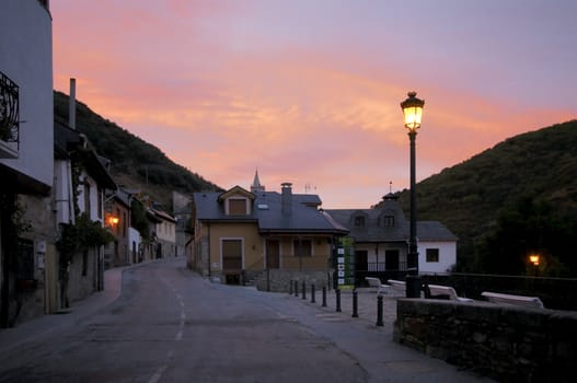 Empty street by sunrise at Molinaseca, Spain