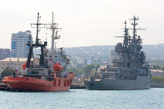 View of ships in port against blue sky, Novorossiysk, Russia.