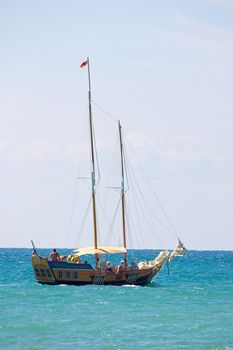 A boat with  deflated sails on  water of  Black Sea.