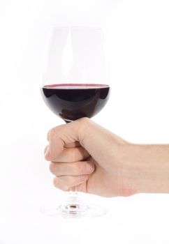 Hand holding glass of red whine. Studio shot. White background.