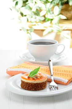 A nontraditional carrot cake served with fresh coffee.