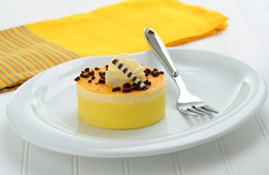 Individual serving of lemon cake on a white plate.