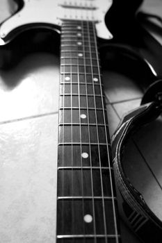 Black and white close up of neck of guitar