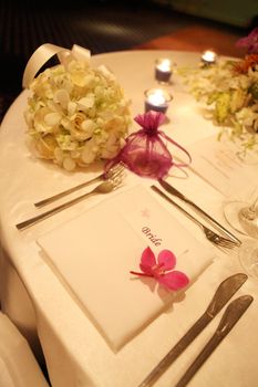 Tables decorated for a wedding reception.