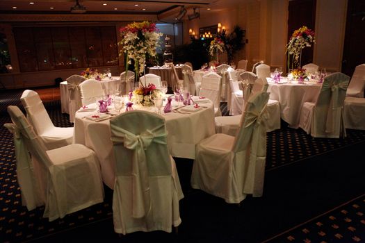 Tables decorated for a wedding reception.