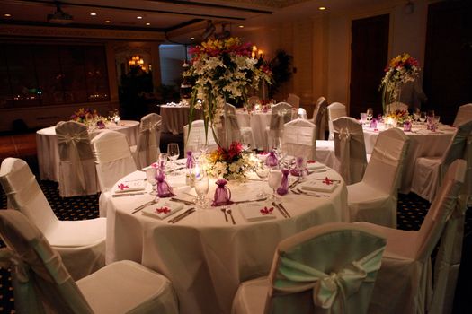 Tables decorated for a wedding reception.