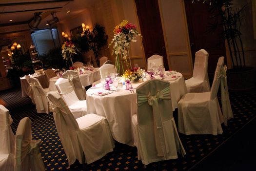 Tables decorated for a wedding reception.