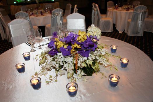 Tables decorated for a wedding reception.