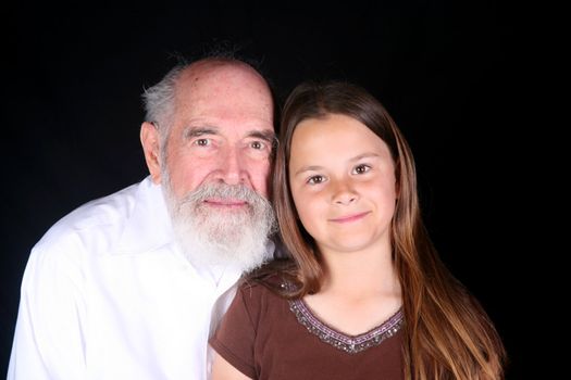 Grandparent with grandchild isolated on black background