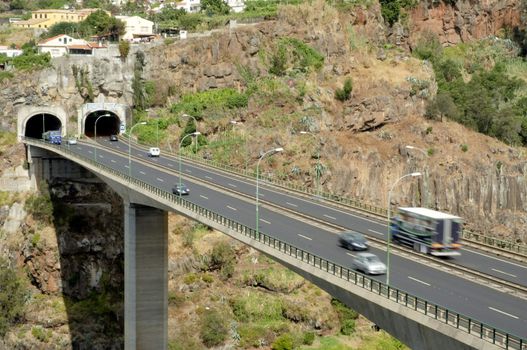 Traffic at highway with tunnel