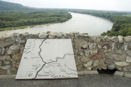view from famous landmark - devin castle, river donau dividing slovakia and austria, map in foreground